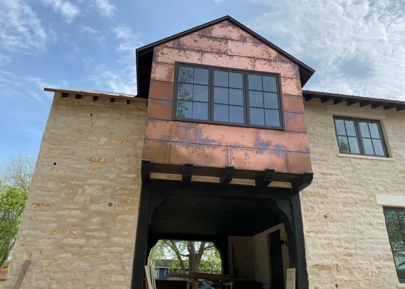 Copper metal panel facade on a stone building for Metal Roof Coating in Union City